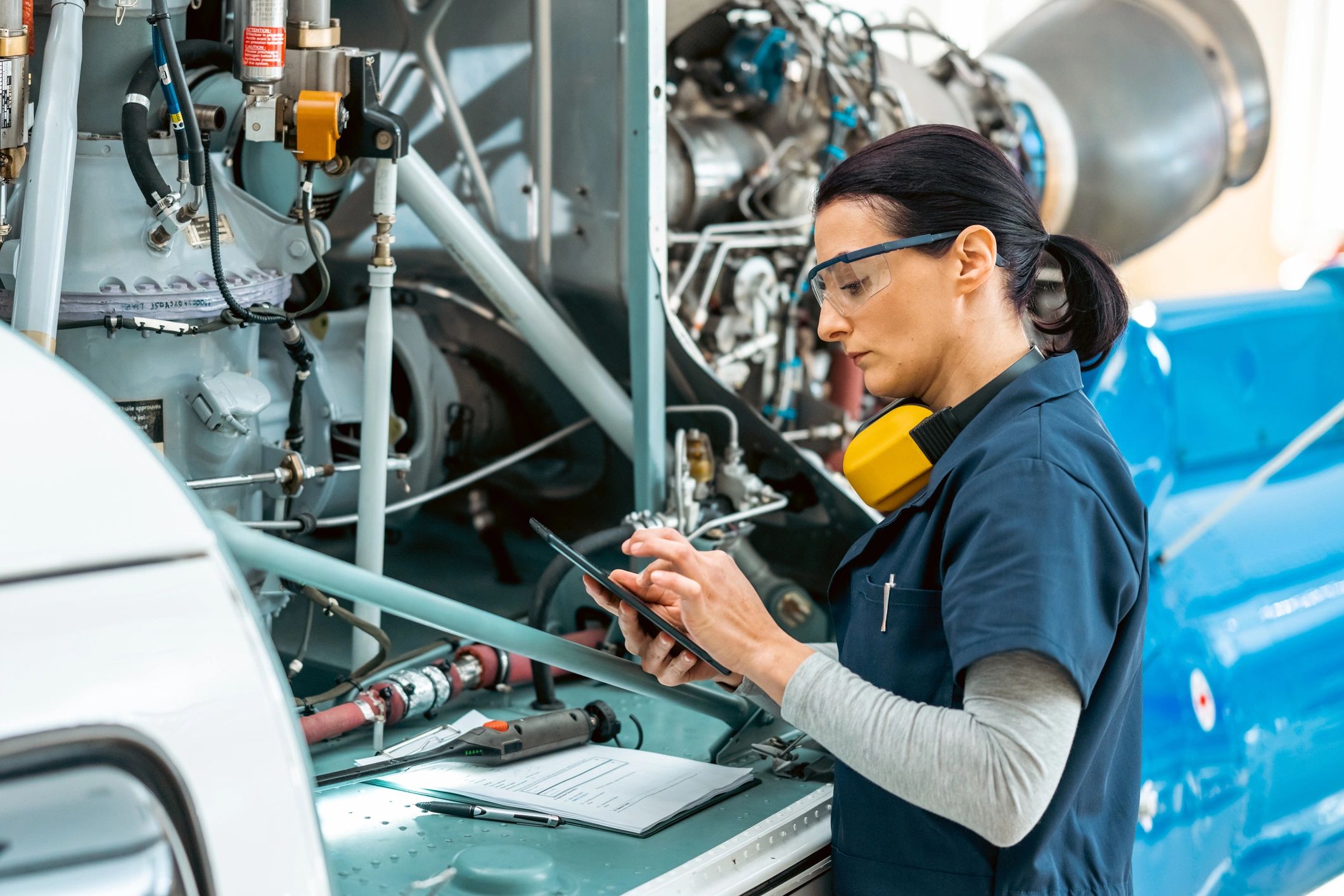 Machining professional reviewing technical work in a workshop